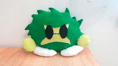 greensward plushie by Souly on a desk
